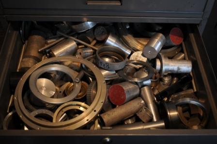 Drawer full of metal rings and posts
