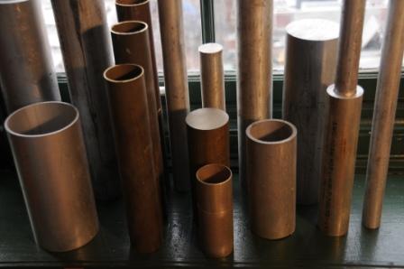 Various metal shapes and pieces, posts, and tubes awaiting use in one of John Snyder's sculptures.